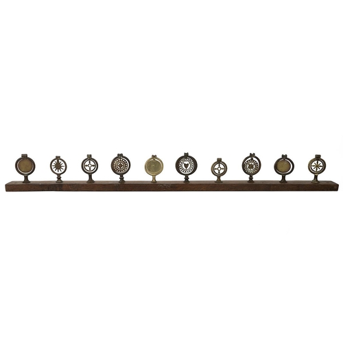 65 - 10x vintage Horse brasses mounted on wooden beam. These were probably placed on the back of a carria... 