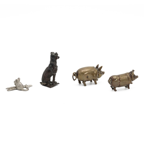 68 - Two brass vesta cases in the form of pigs, a bronzed figure of a dog and a white metal mouse.