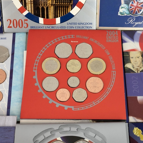 83 - UK Brilliant Uncirculated coin sets from 1980's to early 2000's (27 sets), commemorative crowns and ... 