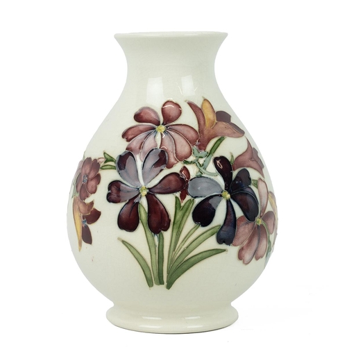 127 - Walter Moorcroft baluster form vase, circa 1960’s, cream ground tube lined decoration of spring flow... 