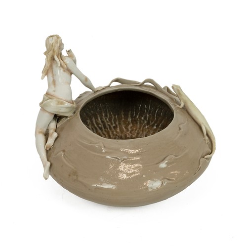 132 - Art Nouveau bowl in brown glaze with applied figures of a maiden and lizard in white, the base beari... 