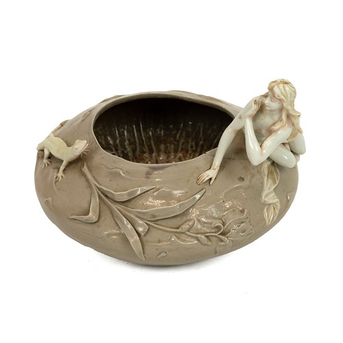 132 - Art Nouveau bowl in brown glaze with applied figures of a maiden and lizard in white, the base beari... 