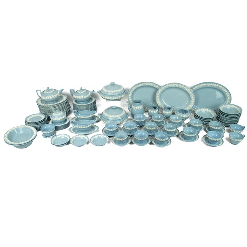 140 - Wedgwood 'Queen's Ware' embossed dinner and tea service, in pale blue ground with applied grapevine ... 