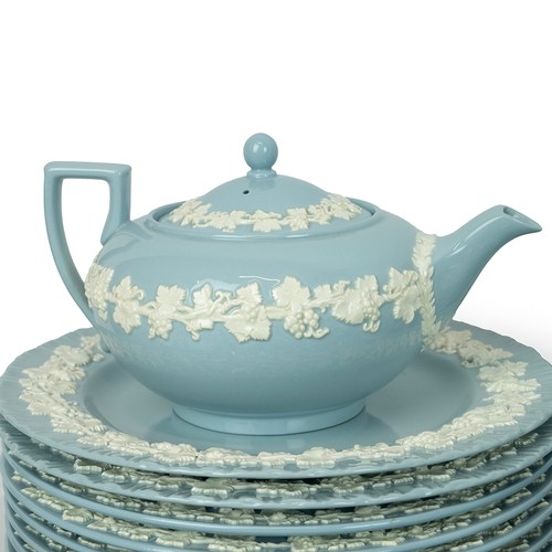 140 - Wedgwood 'Queen's Ware' embossed dinner and tea service, in pale blue ground with applied grapevine ... 