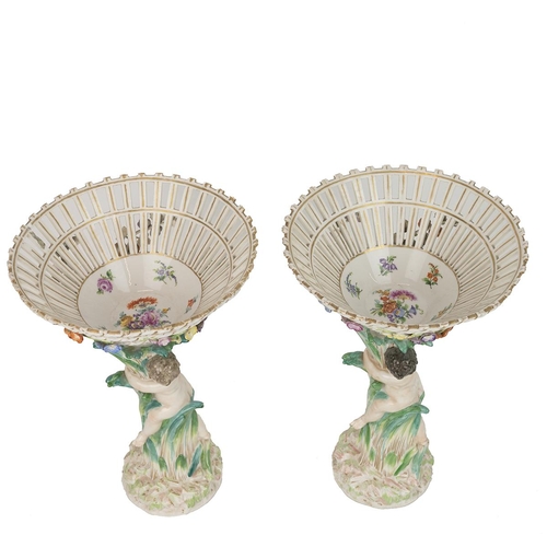 146 - Pair of 19th Century Dresden style funnel basket comports with putti or cherubim figures in parcel g... 