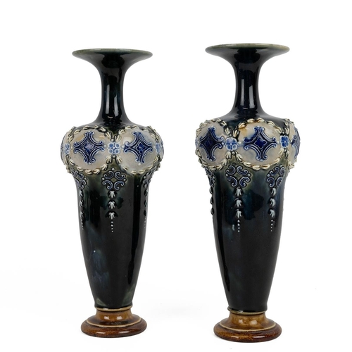 150 - Royal Doulton, circa 1900, a pair of high shouldered vases with slender necks the rims flaring to di... 