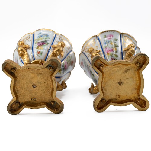 151 - Pair of hand painted porcelain floral pattern and parcel gilt cups, in the style of 18th Century Wor... 