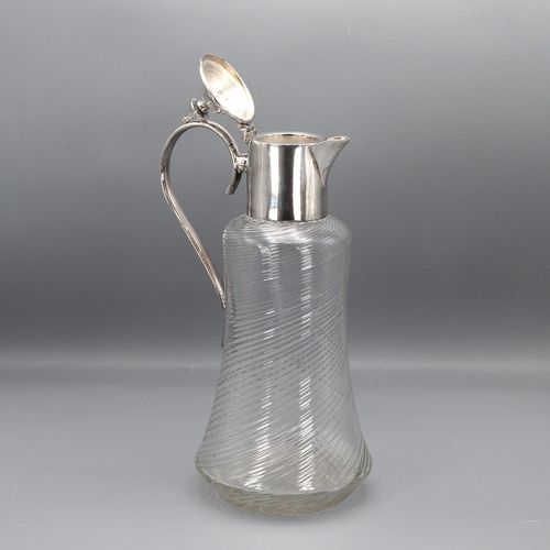 153 - Early 20th Century spiral glass claret jug with silver plated mounts and a loop handle, 29cm high.