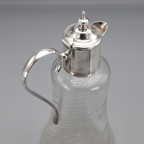 153 - Early 20th Century spiral glass claret jug with silver plated mounts and a loop handle, 29cm high.