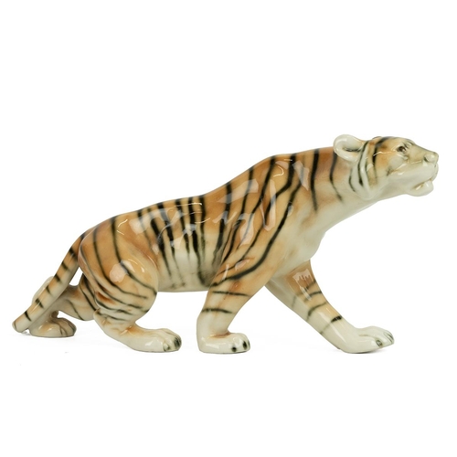 204 - Royal Dux porcelain figurine of a prowling tiger. 32cm length