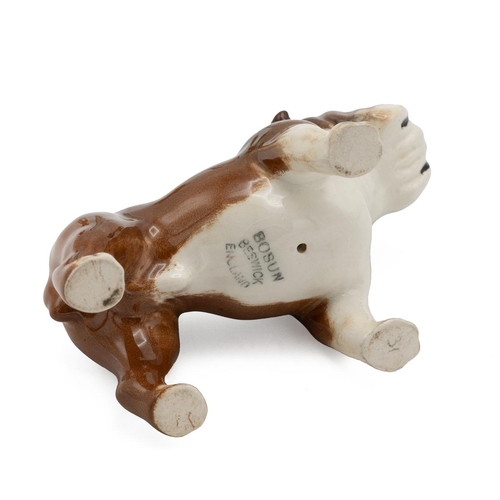 205 - Beswick porcelain figurines of dogs to include a corgi, bulldog, two cocker spaniels, Airedale terri... 