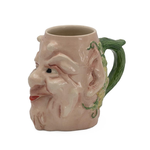 211 - Sarreguemines pottery grotesque face jug, with devil horns and grape vines to the reverse, triangle ... 