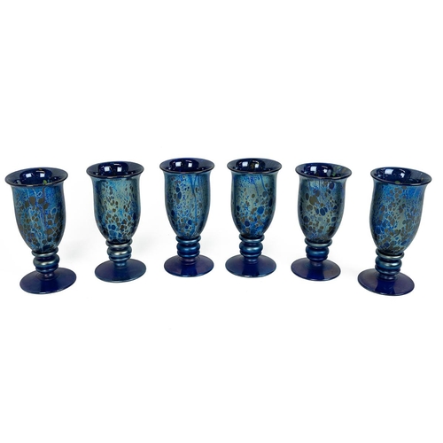 227 - Isle of Wight glass - set of six iridescent blue glasses together with: a pink marbled glass set com... 