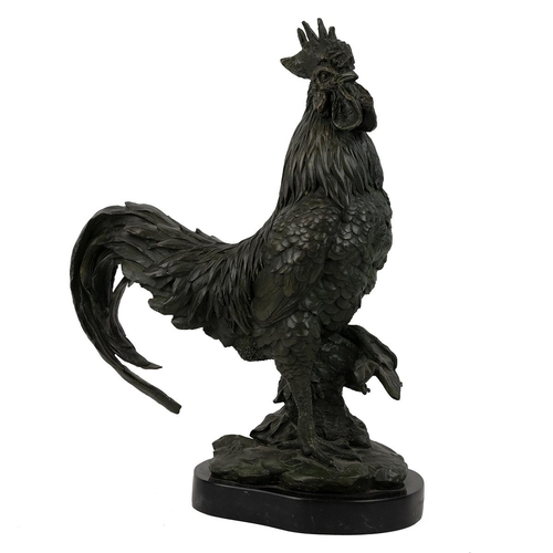 251 - Patinated bronze cockerel, well executed, shown standing on an ivy covered stump, on a marble socle.... 