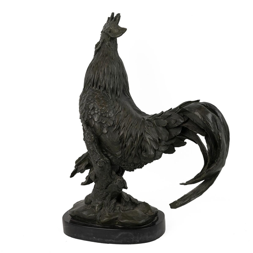 251 - Patinated bronze cockerel, well executed, shown standing on an ivy covered stump, on a marble socle.... 