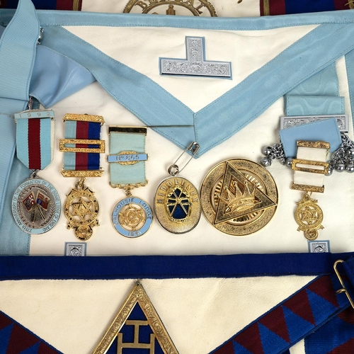 330 - An extensive collection of Masonic items, including assorted neck collars, medals and aprons various... 