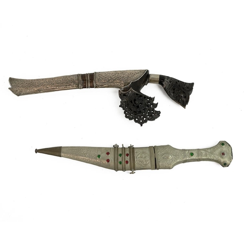 348 - Two middle Eastern daggers, to include a Sumatra dagger with carved and pierced decorated horn handl... 