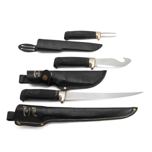 392 - Three Finnish Marttiini fishing/hunting knives, each with a leather scabbard.