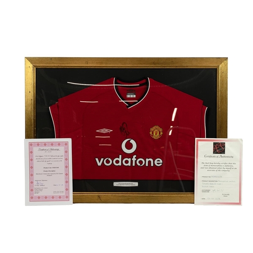 396 - Manchester United - Two signed signed football shirts, Ole Gunnar Solskjaer and Dwight Yorke, framed... 