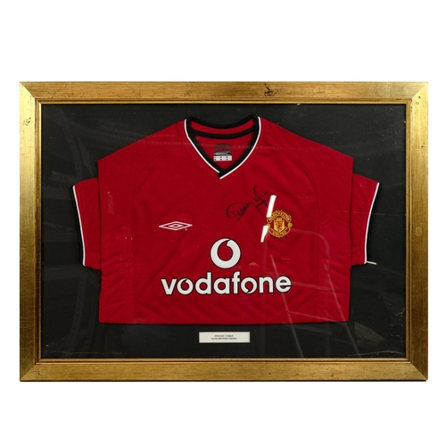 396 - Manchester United - Two signed signed football shirts, Ole Gunnar Solskjaer and Dwight Yorke, framed... 