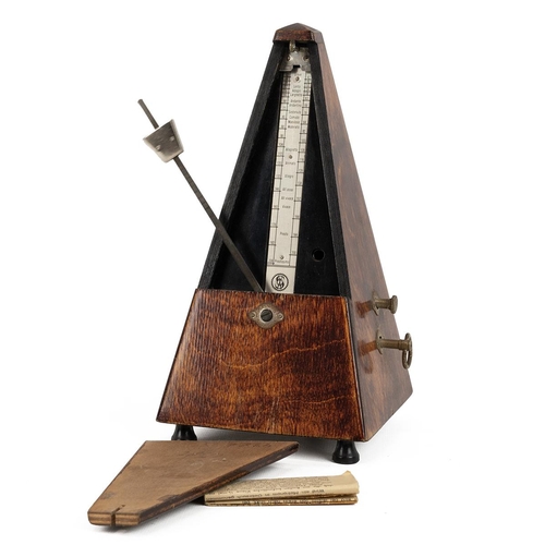 416 - Two conductor's batons and a metronome. The first by Callow and Sons, of carved to appear as bamboo,... 