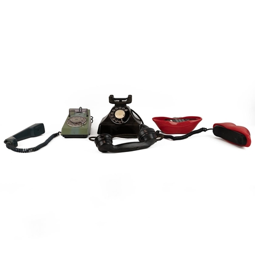 437 - Three retro and vintage telephones to include a red 'Hot Lips', a two-tone green spin dial 'Trim Pho... 