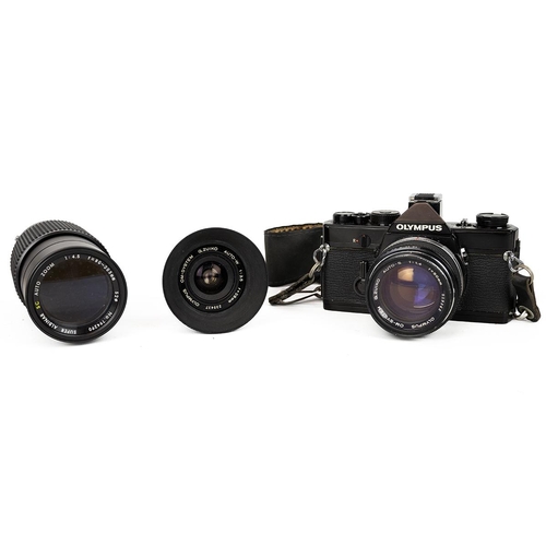 451 - Olympus OM-1 35mm camera (untested), with three Olympus Zuiko lenses to include 50mm standard, 80mm-... 