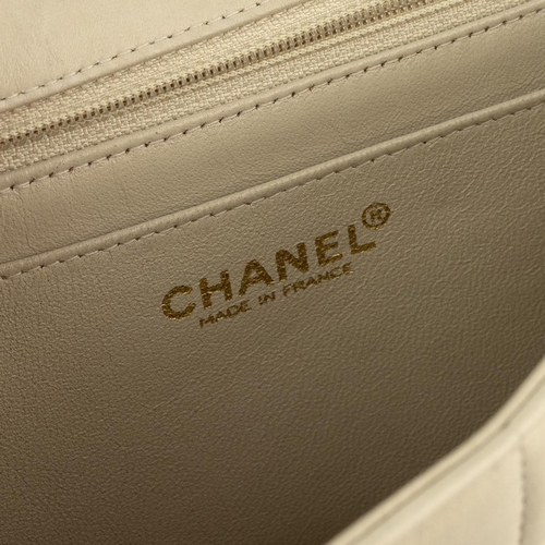 458 - Chanel chocolate bar quilted lambskin charm handbag, circa 2002-2003, in light tan/cream.Serial no. ... 