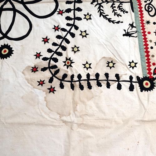 470 - An early 20th century child's quilt, decorated with animal border and central panel of birds, animal... 