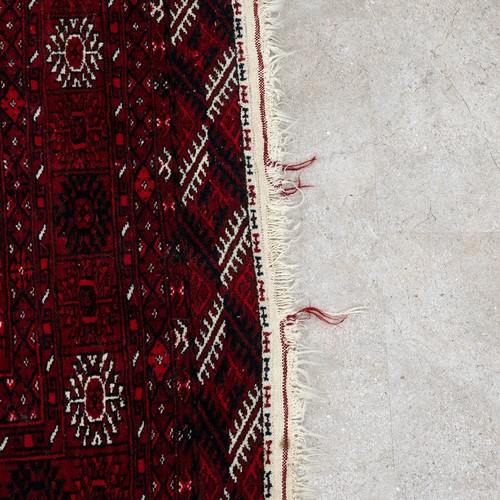 473 - Vintage cow hide rug, 218cm x 185cm, along with an Tekke rug, 193cm x 123cm.