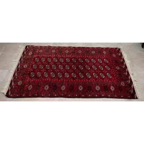 473 - Vintage cow hide rug, 218cm x 185cm, along with an Tekke rug, 193cm x 123cm.