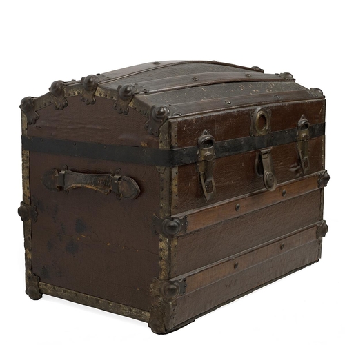 511 - Domed top trunk of lath and canvas construction, with medal bonding and leather carry straps, the la... 