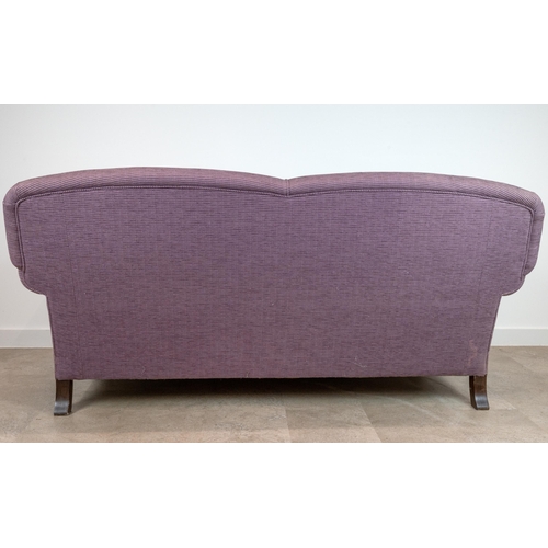 522 - A contemporary 2.5 Seater Sofa upholstered in a lilac corduroy, raised on mahogany bun supports to c... 