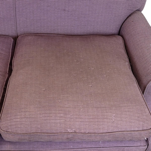 522 - A contemporary 2.5 Seater Sofa upholstered in a lilac corduroy, raised on mahogany bun supports to c... 