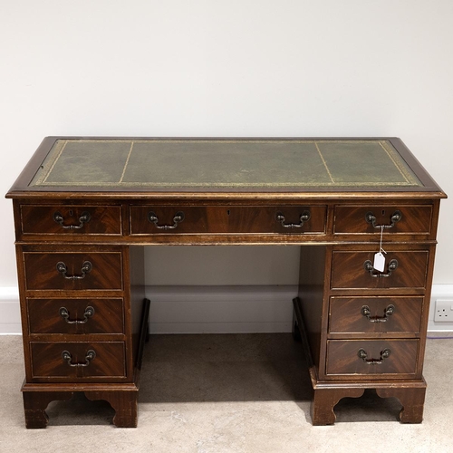 524 - A contemporary tooled leather topped twin pedestal desk with a central drawer flanked by 8 short dra... 