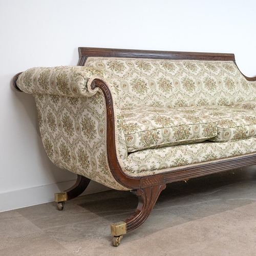 526 - 19th-century mahogany framed sofa, with scroll arms, a reeded and shaped back, 86cm high, 206cm long... 