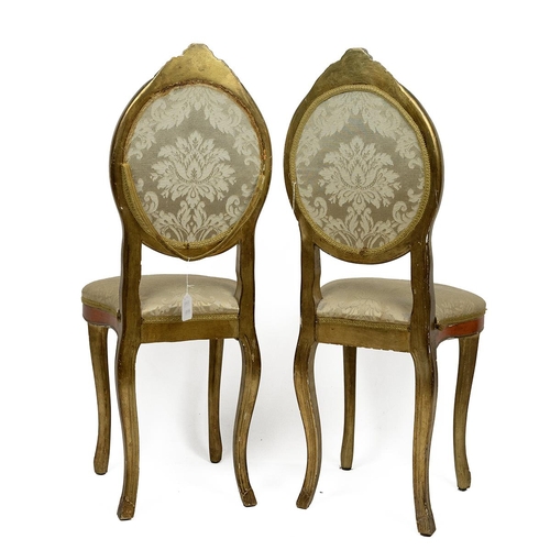 536 - Pair of Italian gilt-wood side chairs. Carved detailing to the legs and top, orange detailing over t... 