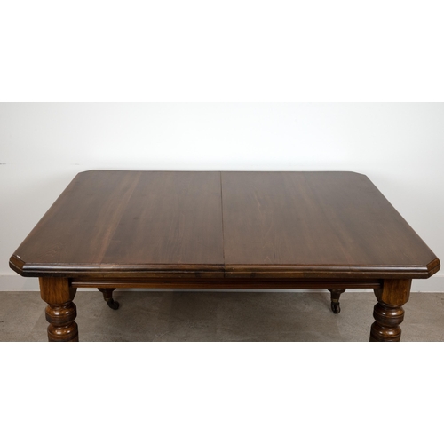 546 - An Edwardian mahogany wind out dining table with chamfered corners and two extra leaves (46.5cm), ra... 