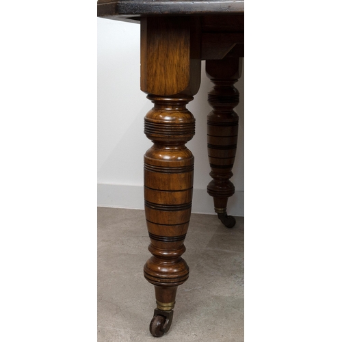 546 - An Edwardian mahogany wind out dining table with chamfered corners and two extra leaves (46.5cm), ra... 