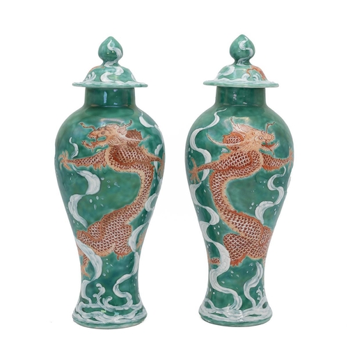 190 - Pair of Chinese style vases and cover decorated with carp to the lid and a cloud dragon a carp to th... 