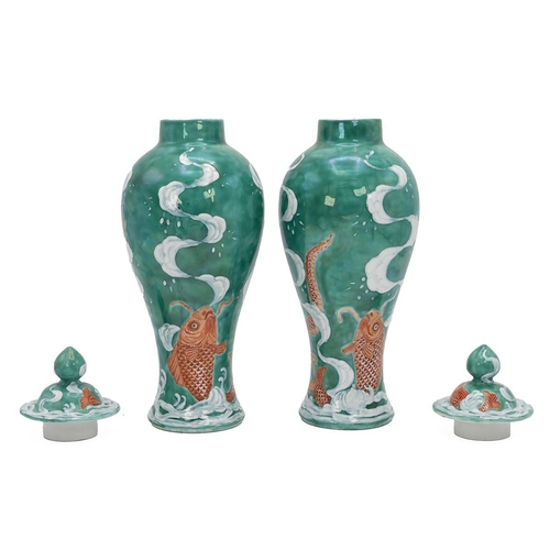 190 - Pair of Chinese style vases and cover decorated with carp to the lid and a cloud dragon a carp to th... 