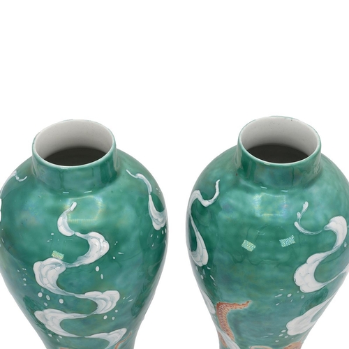 190 - Pair of Chinese style vases and cover decorated with carp to the lid and a cloud dragon a carp to th... 