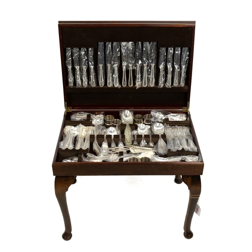 203 - Osborne 8 setting canteen of cutlery (unused) in fitted mahogany tooled leather topped table, raised... 