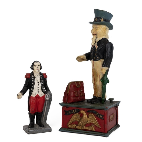 209 - Two novelty money boxes. Uncle Sam, cast metal with polychrome finish, mechanical, upon pressing the... 
