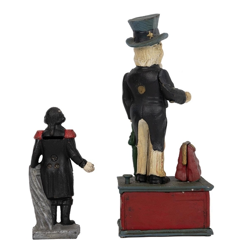 209 - Two novelty money boxes. Uncle Sam, cast metal with polychrome finish, mechanical, upon pressing the... 