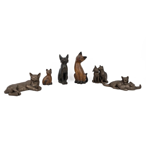 211 - Paul Jenkins for Frith Sculptures - three resin cast cat figurines, together with two carved wood ca... 