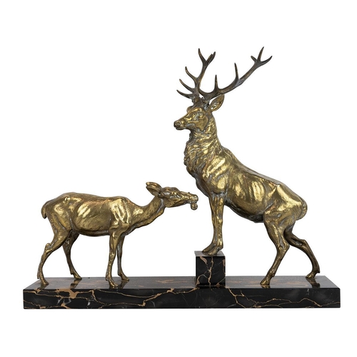 213 - Art Deco gilt metal figural group of a stag and doe, c1930s, signed 'L.Carvin'. Mounted on black mar... 