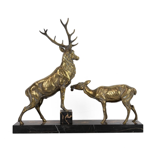 213 - Art Deco gilt metal figural group of a stag and doe, c1930s, signed 'L.Carvin'. Mounted on black mar... 