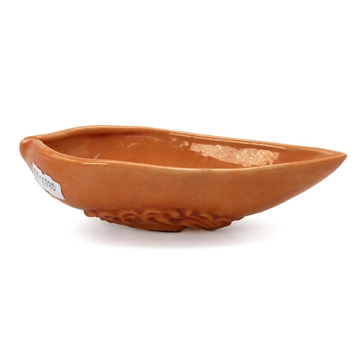 238 - A Chinese monochrome glazed porcelain vessel, 20th-century. Of leaf shape, glazed in coral, a moulde... 