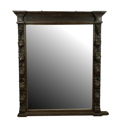 546 - Victorian oak carved Green Man over mantle mirror, the mirror flanked by two columns decorated with ... 